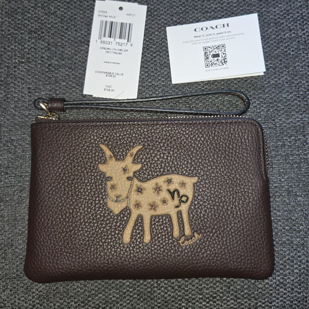 Coach Brown Pebbled Leather Wristlet with Goat Patch